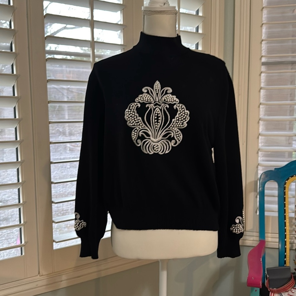 Beautiful ST John. Knit sweater with great pearl application.  Size Large